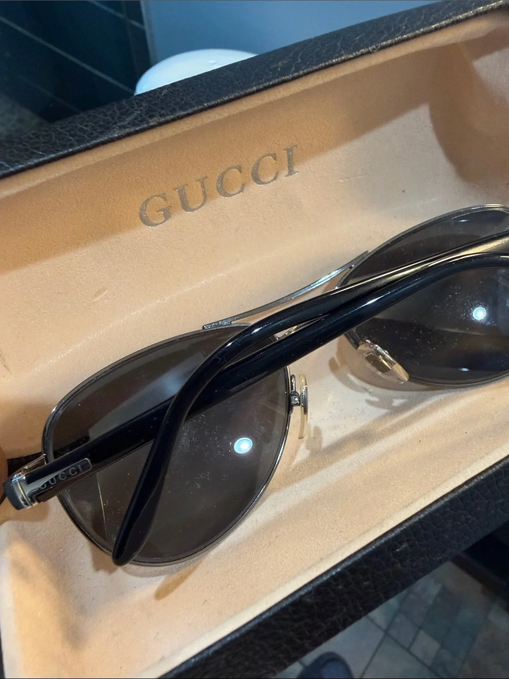 Gucci Men's Black Oval Sunglasses with Silver Accents